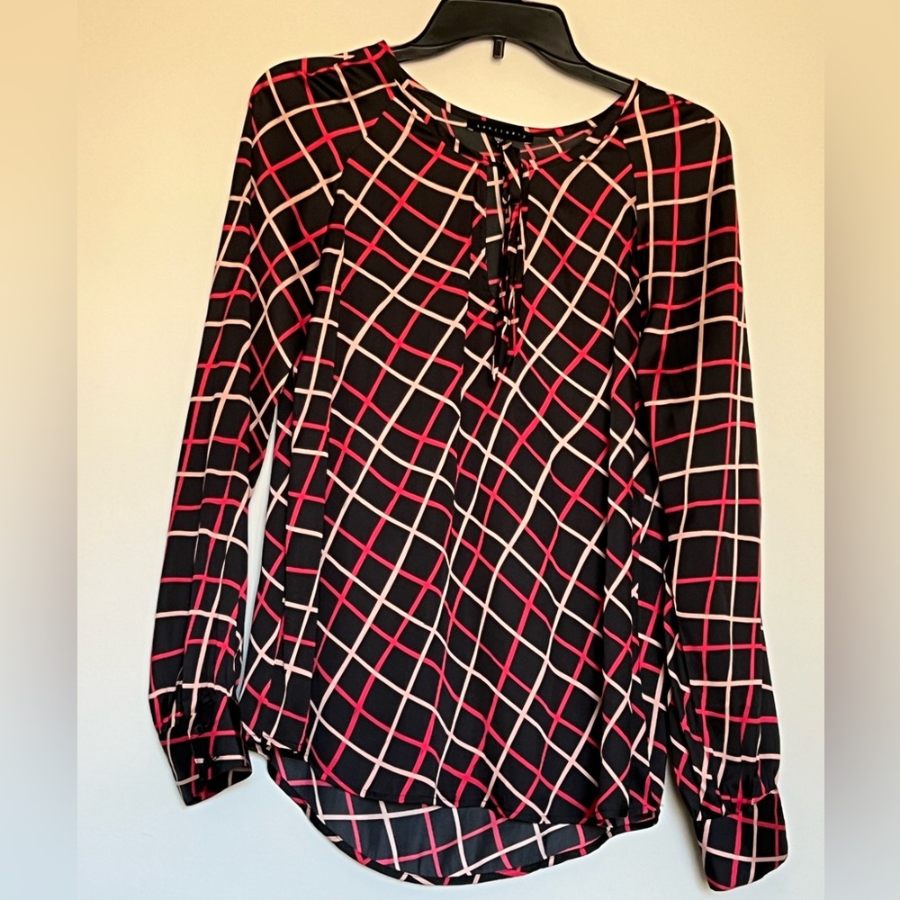 Black long sleeve shirt with red and gold lines for design. Size Small
